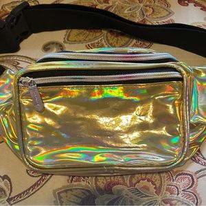 NWOT Gold belt bag, 2 pockets in front, one in bag. Good size, holds a lot!
